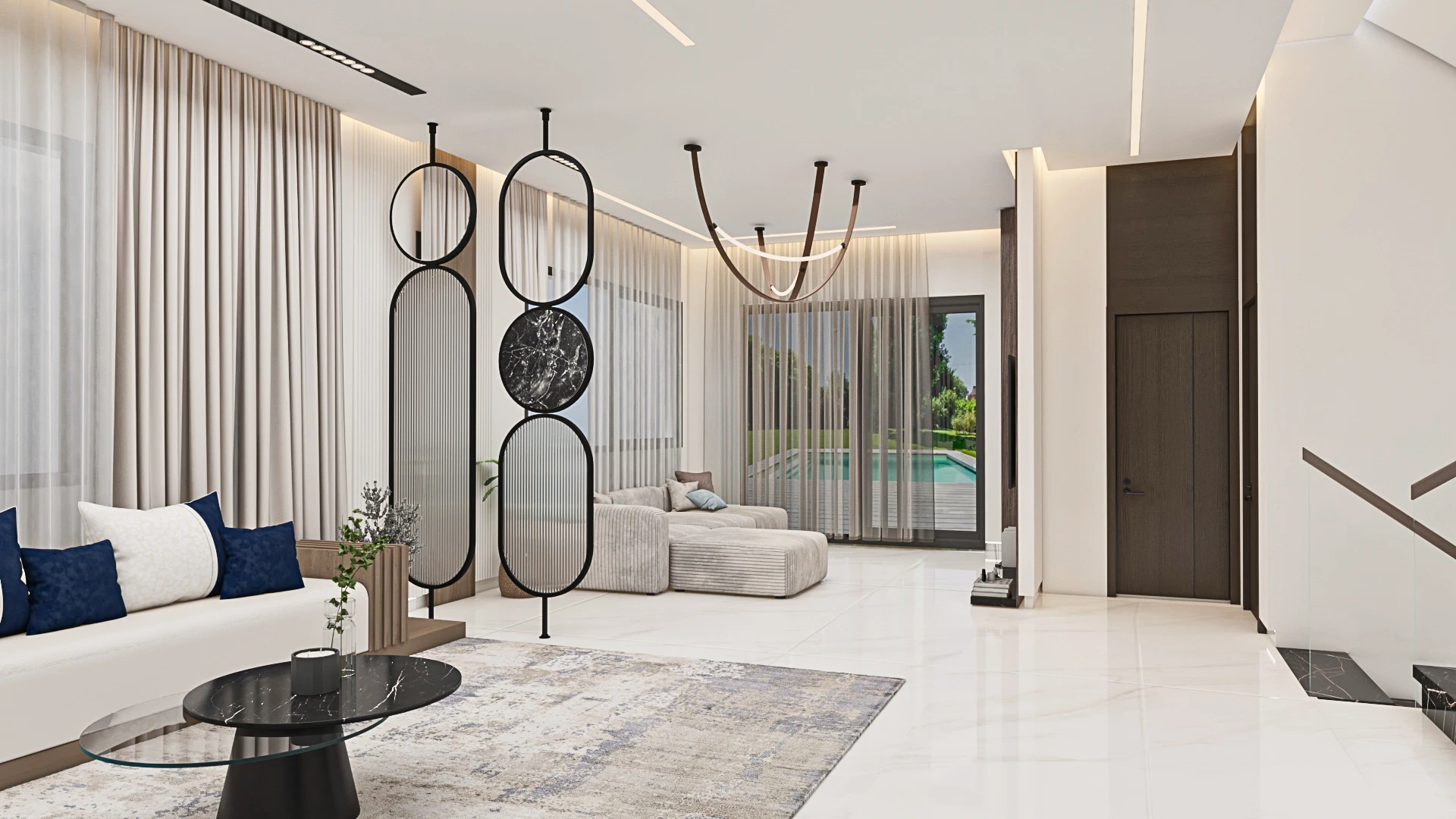 Minimalist living room design at Achakar Gardens with neutral tones, integrated lighting, and contemporary furniture.