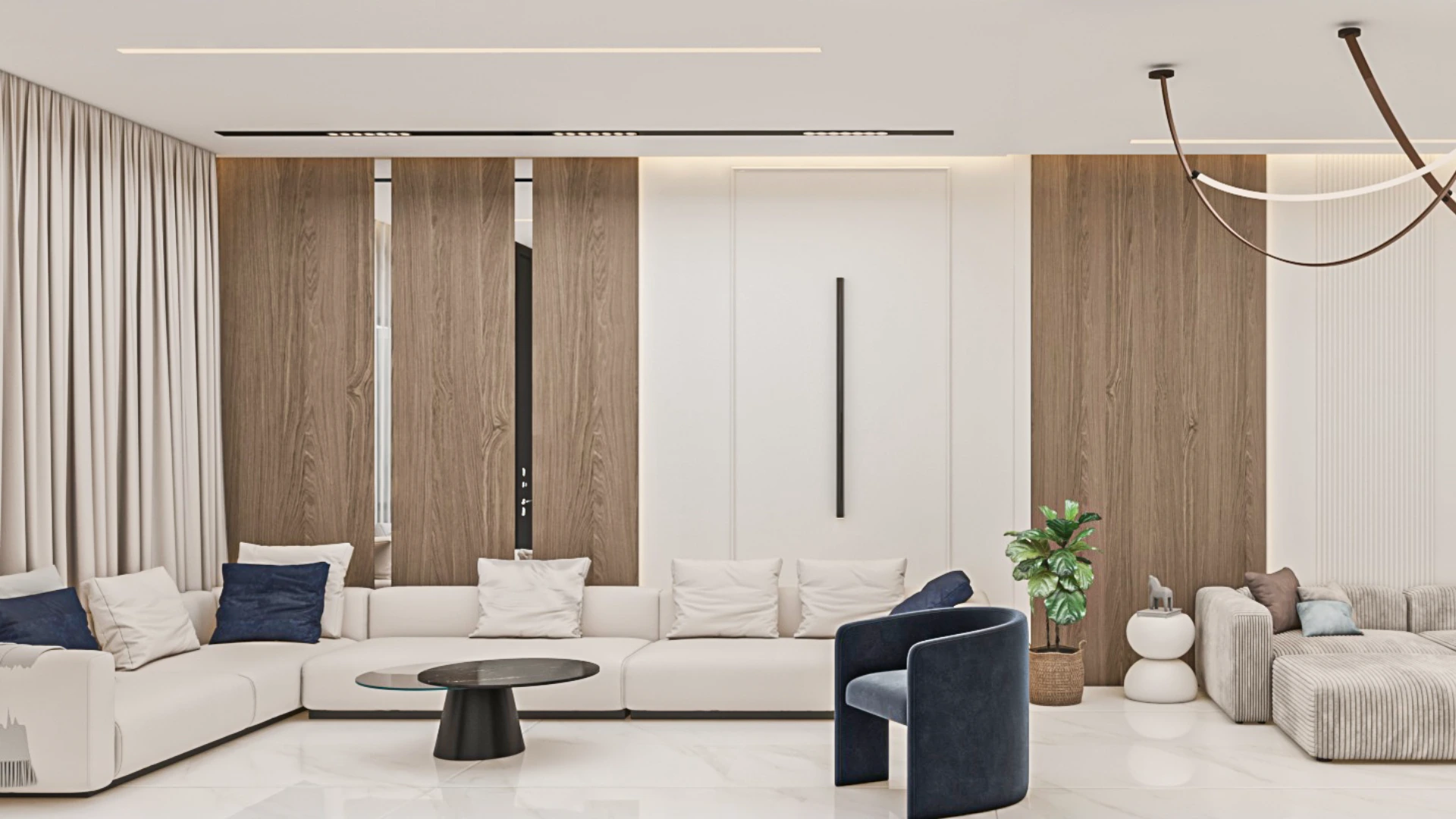 Minimalist living room design at Achakar Gardens with neutral tones, integrated lighting, and contemporary furniture.
